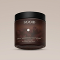 SOOID DM-02 Women's Daily Multivitamin amber glass jar with matte black lid on a warm beige background